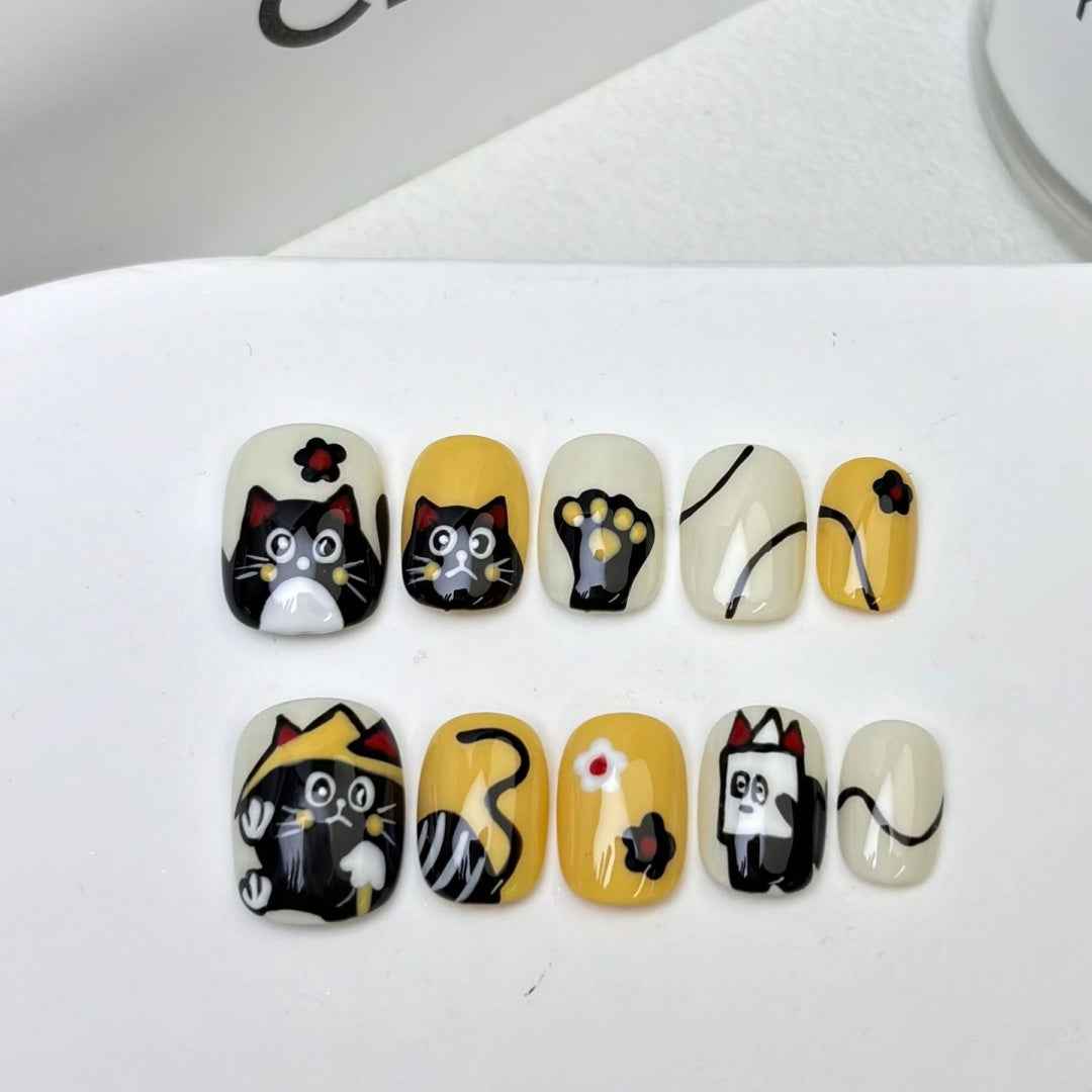 playful kitten - elegant short oval black handmade press on nails